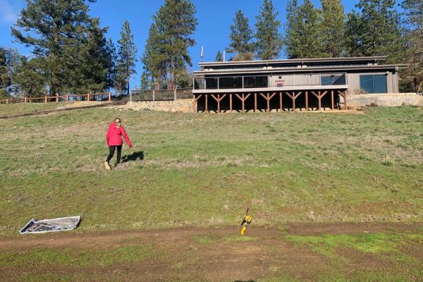 grass-covered sloping hill with plenty of sunshine before landscape design