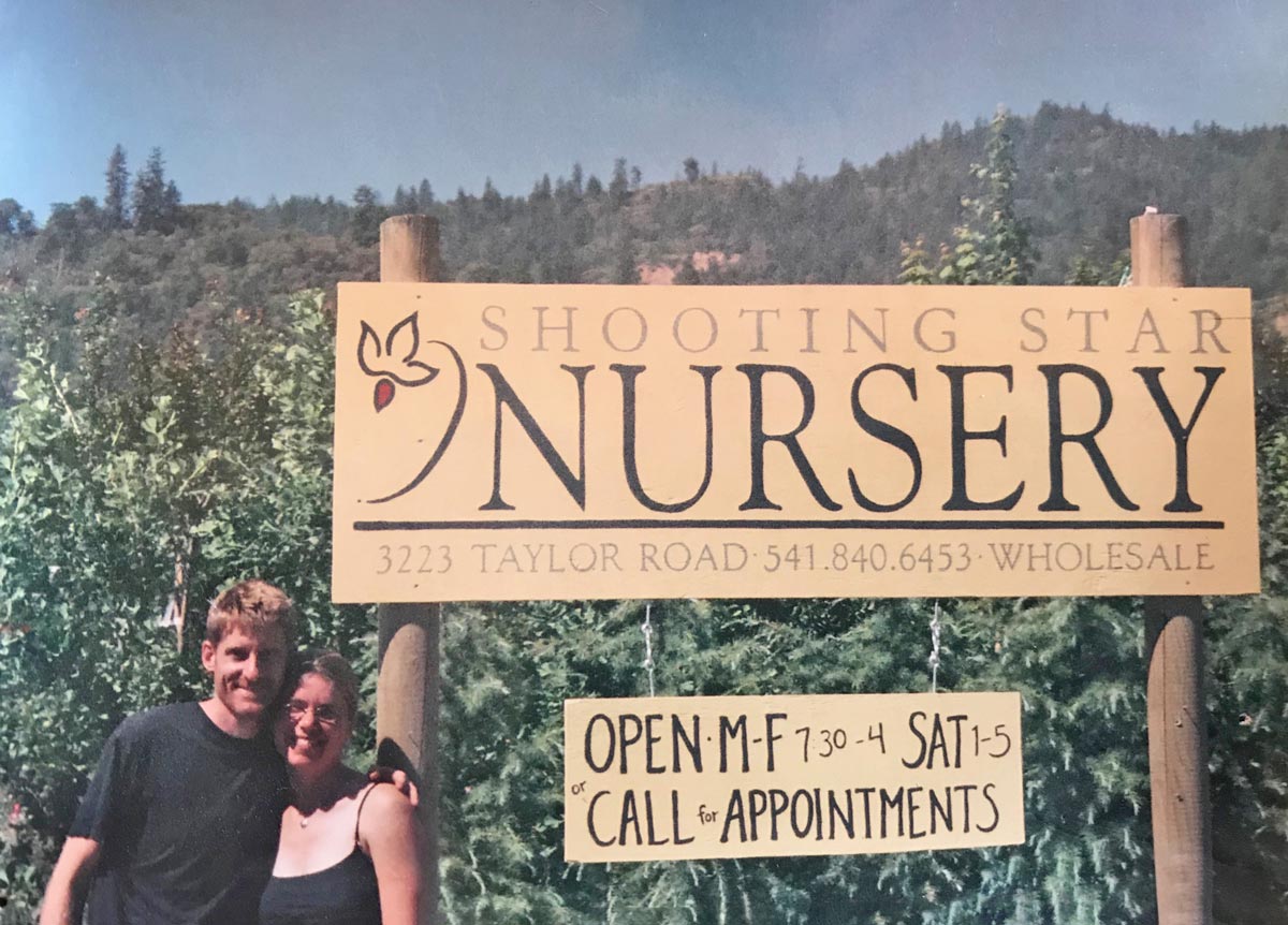 Shooting Star Nursery owners Scott and Christie Mackison in front of their plant nursery sign in 2005